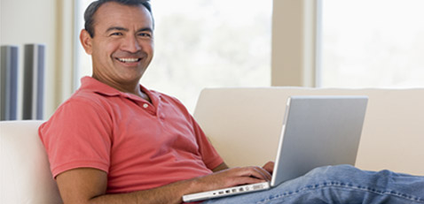 Adult man using laptop